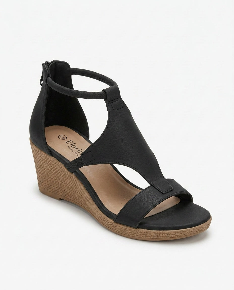 Graceful women's black strappy wedge sandals. Comfortable, elegant summer dress footwear.
