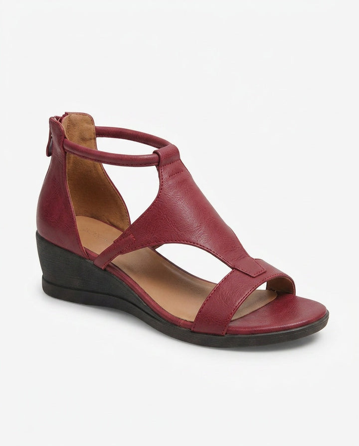 Black strappy wedge sandals for women. Elegant and comfortable summer dress footwear.
