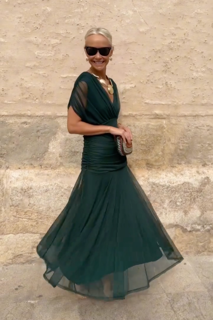 Off-shoulder pleated floral maxi dress for women. Elegant spring/summer party or evening wear.