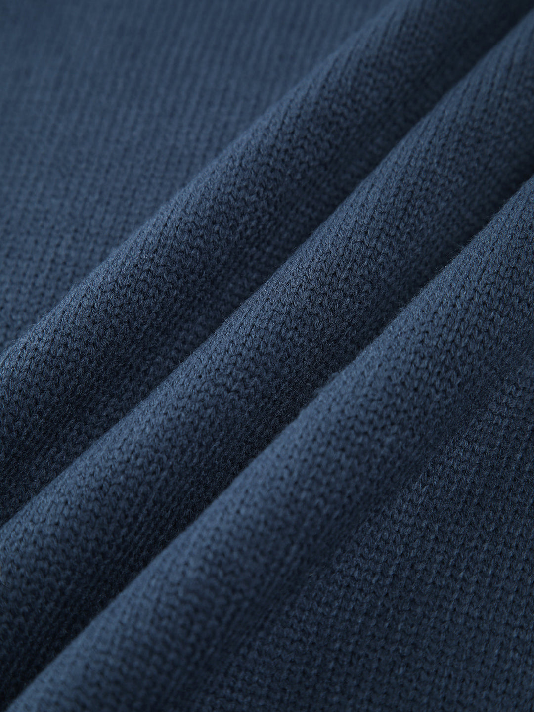 Navy women's ribbed knit sweater with a stylish mock neck, a comfortable layering piece.