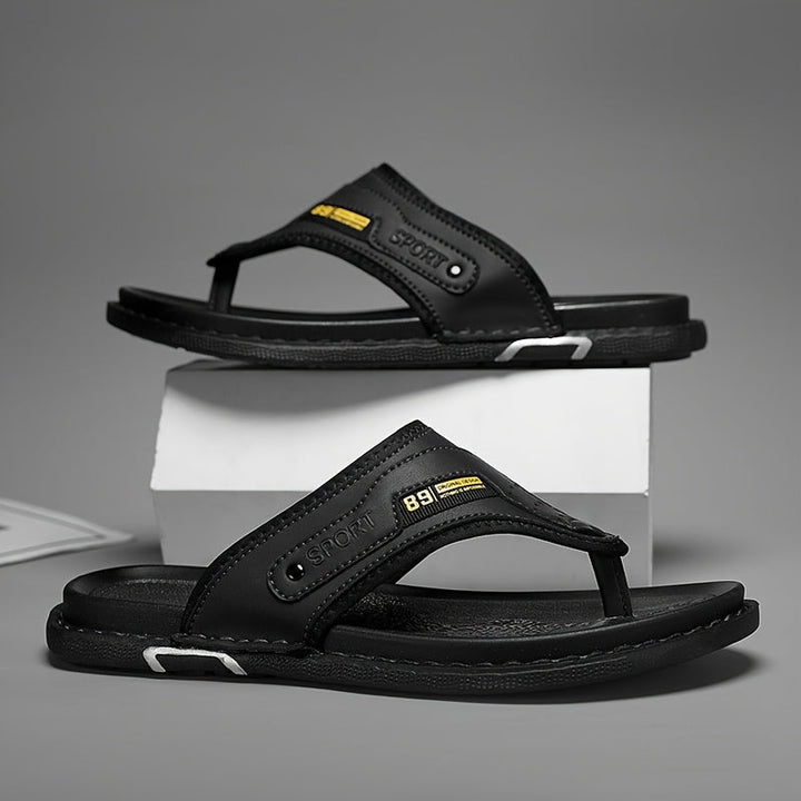 Comfortable men's non-slip thong sandals, stylish black design for all-day summer and beach wear.