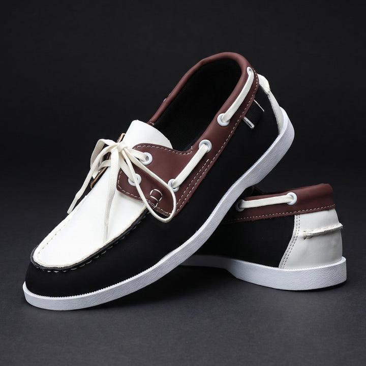 Relaxed fit men's moc toe boat shoes in two-tone. Comfortable, lightweight for versatile summer fashion.