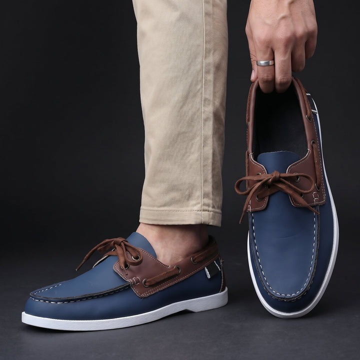 Stylish men's two-tone boat shoes. Lightweight, slip-on design offers relaxed comfort for summer fashion.