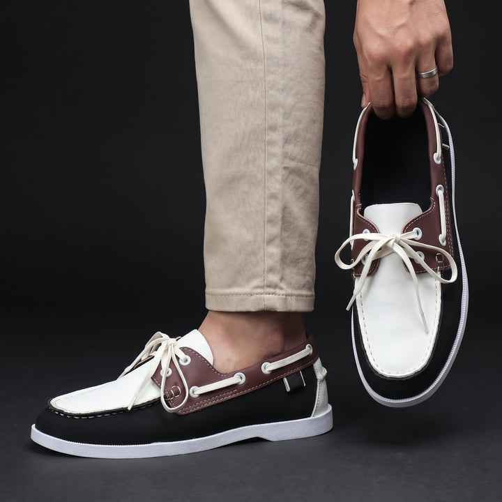 Relaxed men's moc toe boat shoes. Two-tone, lightweight, slip-on design for summer & everyday casual style.