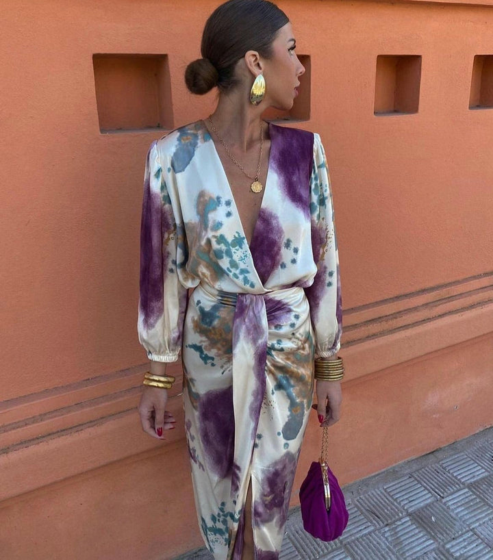 Versatile women's belted wrap midi dress, featuring a flattering V-neckline. Ideal for elegant events.