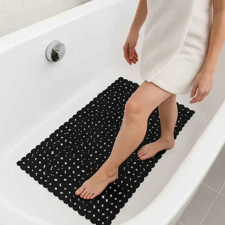 Anti-slip shower mat for bathroom safety, strong suction cups for secure grip on wet floors.