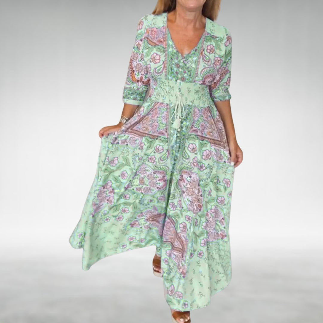 Flowy bohemian long dress with vibrant paisley print & stylish V-neck, ideal for summer fashion.