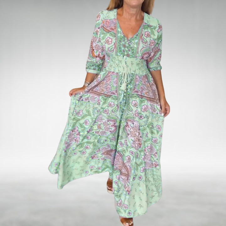 Flowy bohemian long dress with vibrant paisley print & stylish V-neck, ideal for summer fashion.