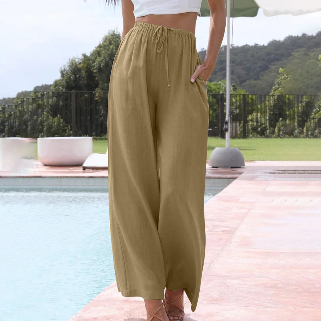 Side view of women's relaxed fit wide leg linen pants with drawstring waist, ideal for summer fashion.