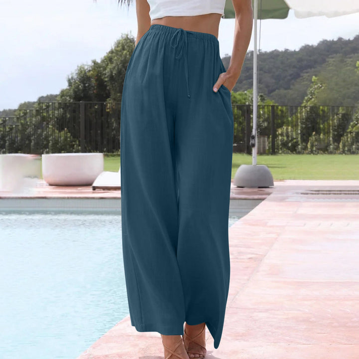 Stylish women's wide leg linen pants, featuring comfortable drawstring waist & relaxed fit for summer.