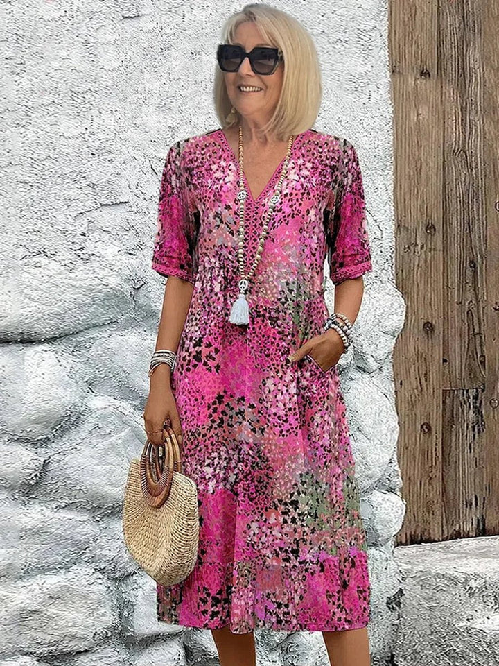 Relaxed fit women's floral V-neck midi dress, a stylish and comfortable choice for spring, summer, or brunch.