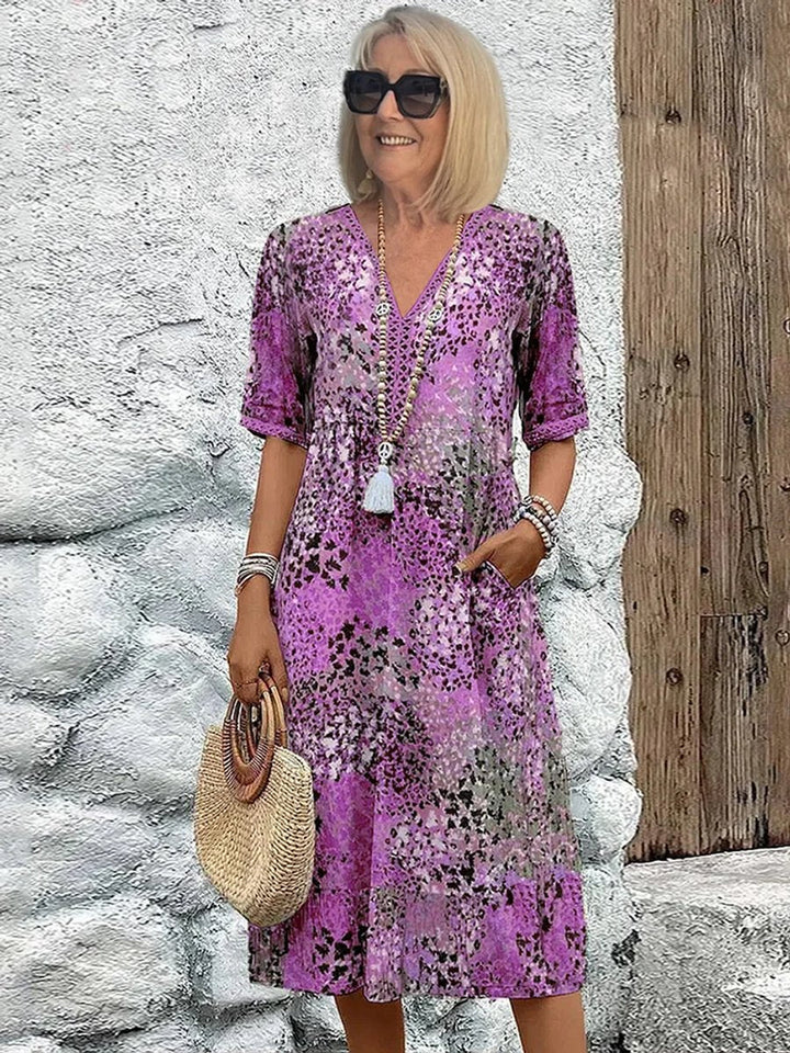 Polished women's casual floral midi dress with V-neck and short sleeves, a chic option for summer or vacation.
