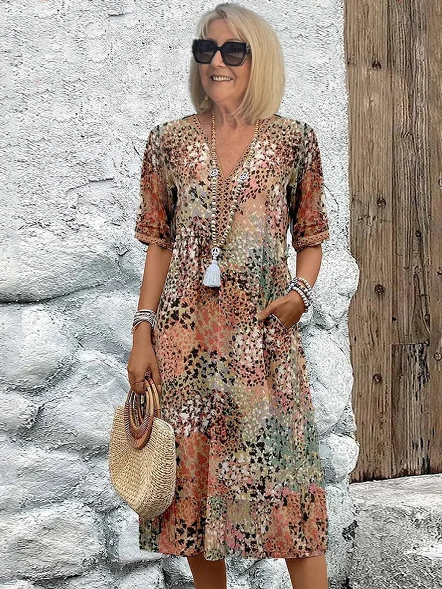 Vibrant floral print V-neck midi dress for women, offering a comfortable, elegant look for casual summer events.
