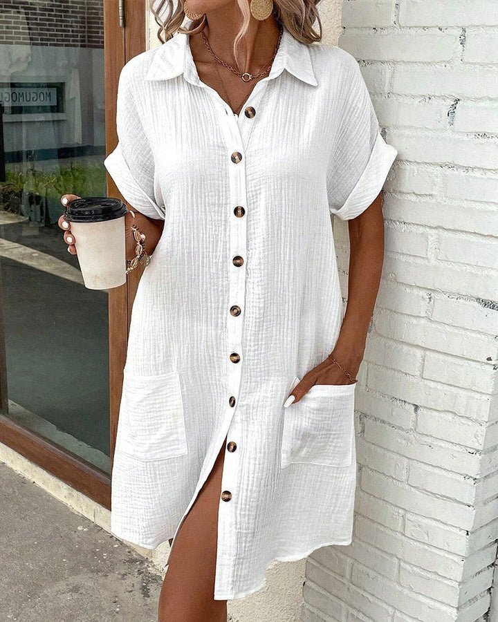 Woman enjoying summer in a relaxed fit flowy midi dress, ideal for casual wear or holiday comfort.