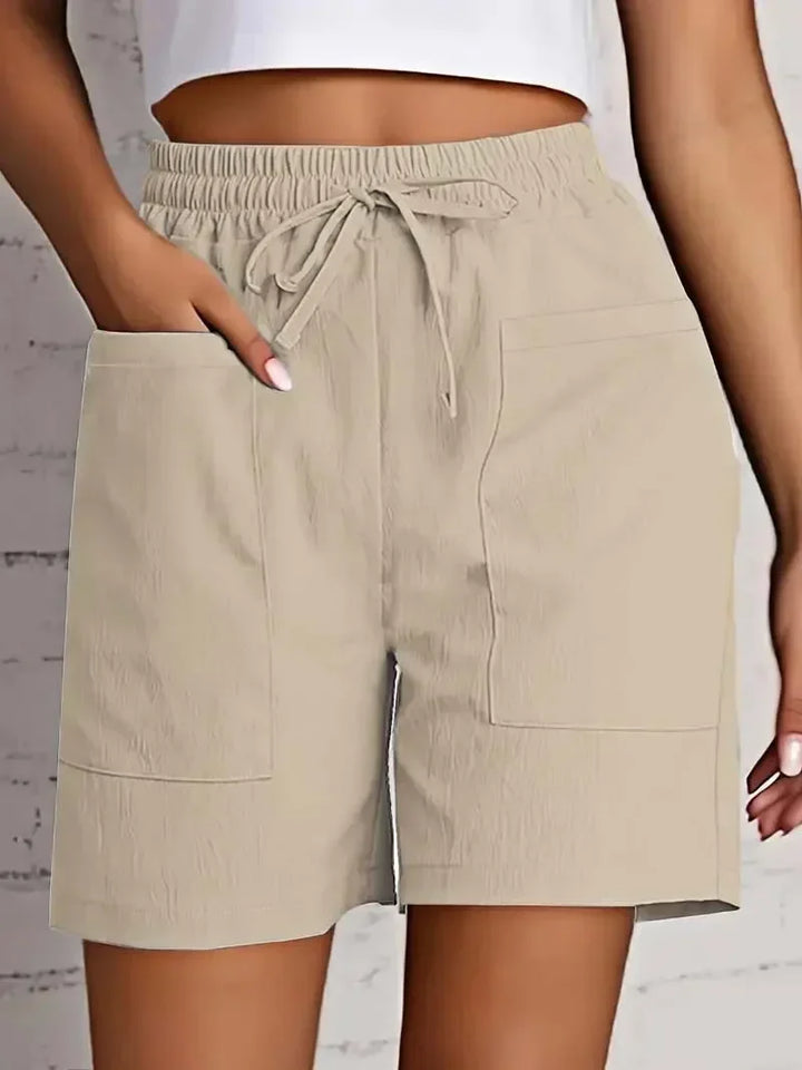 Women's casual bermuda shorts with functional pockets & a comfortable drawstring waist for summer.