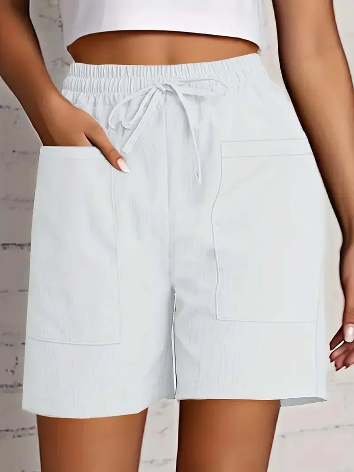 Soft & comfortable women's bermuda shorts with pockets, essential for summer fashion & everyday style.