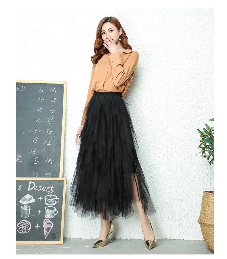 Chic women's high waist midi skirt with flowing tiered ruffles, ideal for versatile wear.
