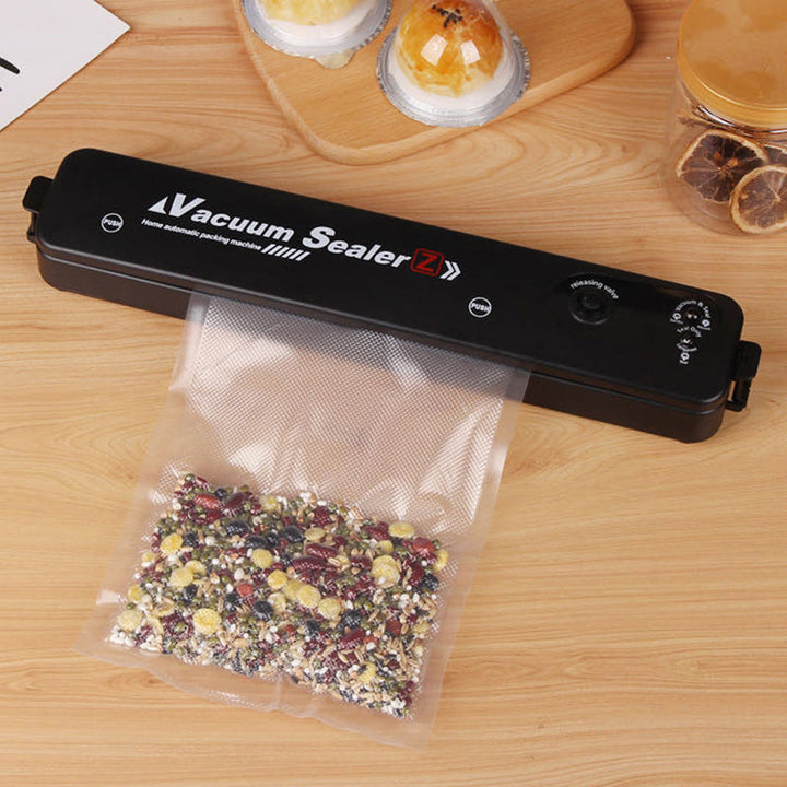 Automatic vacuum sealer for extended food freshness, a sleek kitchen appliance for food storage.