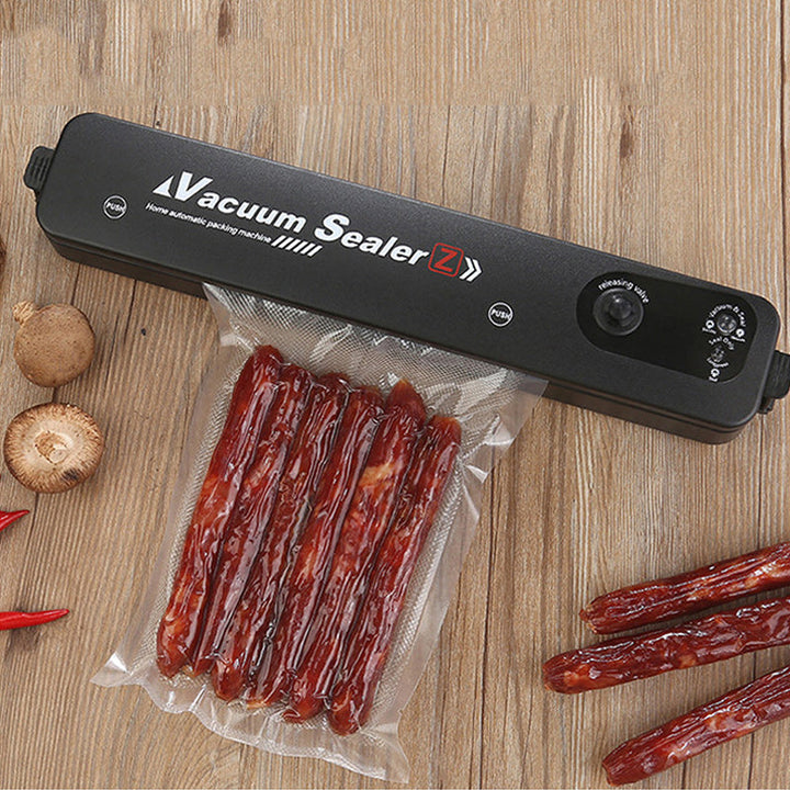 Vacuum sealer in use for meal prep, perfect for storing prepped meals & fresh ingredients efficiently.