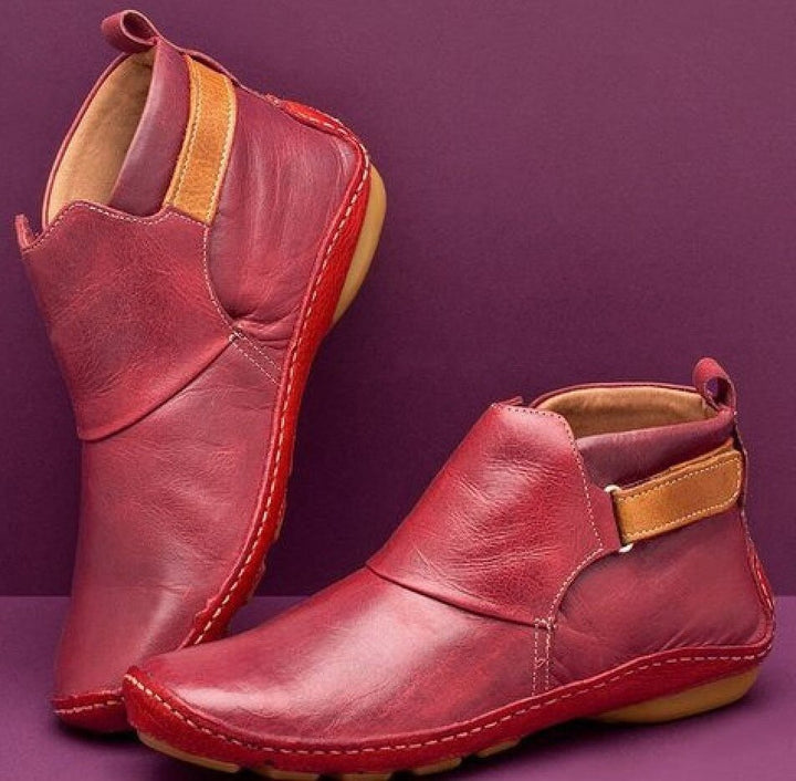 Casual & chic women's ankle boots with flat sole and adjustable strap. Versatile comfortable footwear for winter.