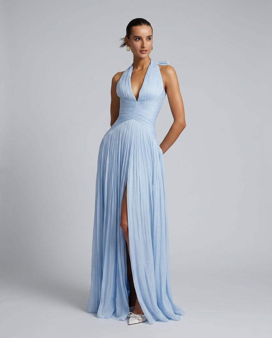 Elegant women's blue plunge neck pleated maxi dress with a slit, ideal for wedding guests & special occasions.