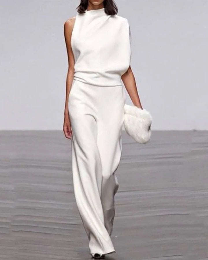 Women's wide leg mock neck jumpsuit with draped shoulder, perfect for elegant formal wear.