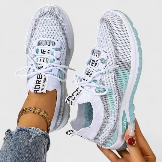 Blue women's breathable lightweight sneakers, offering cushioned support for active & casual wear.
