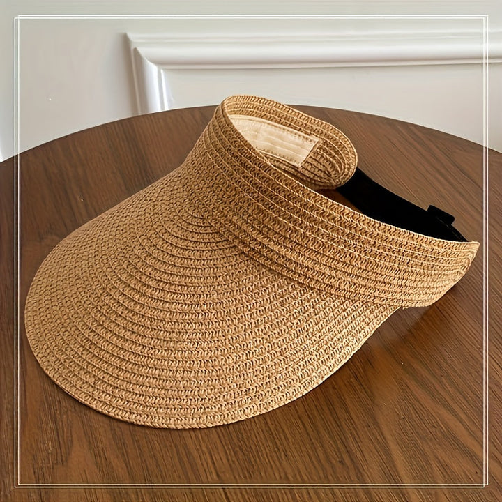 Durable women's foldable wide brim sun visor. Offers reliable UV protection, a versatile accessory for travel & beach.