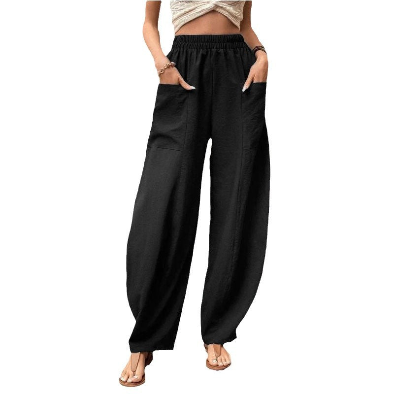 Woman wearing casual wide-leg palazzo trousers with pockets, styled for a comfortable, relaxed everyday look.