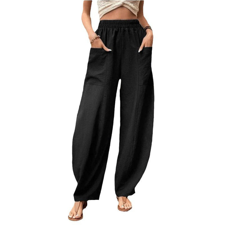 Woman wearing casual wide-leg palazzo trousers with pockets, styled for a comfortable, relaxed everyday look.