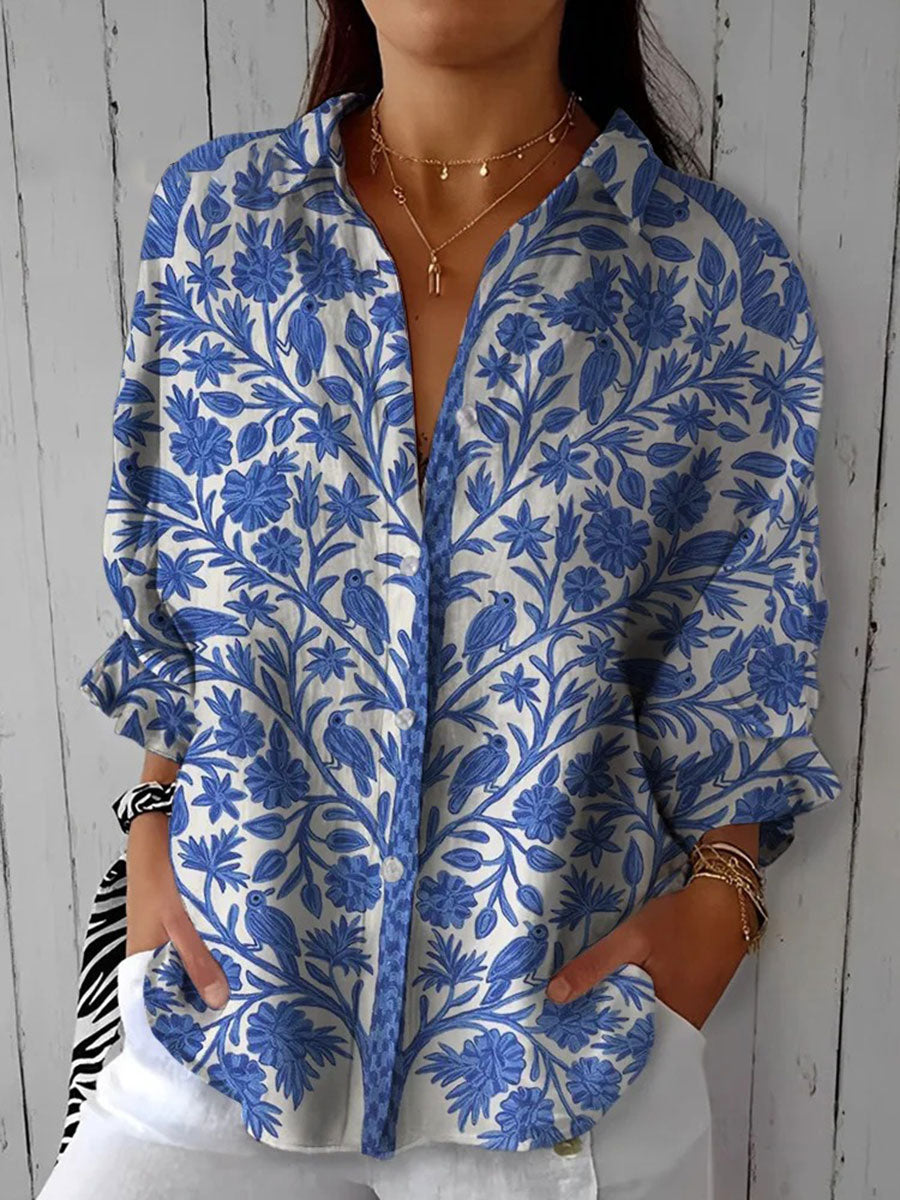 Women's blue floral garden print blouse, a stylish button-down top perfect for spring & summer casual or elegant wear.