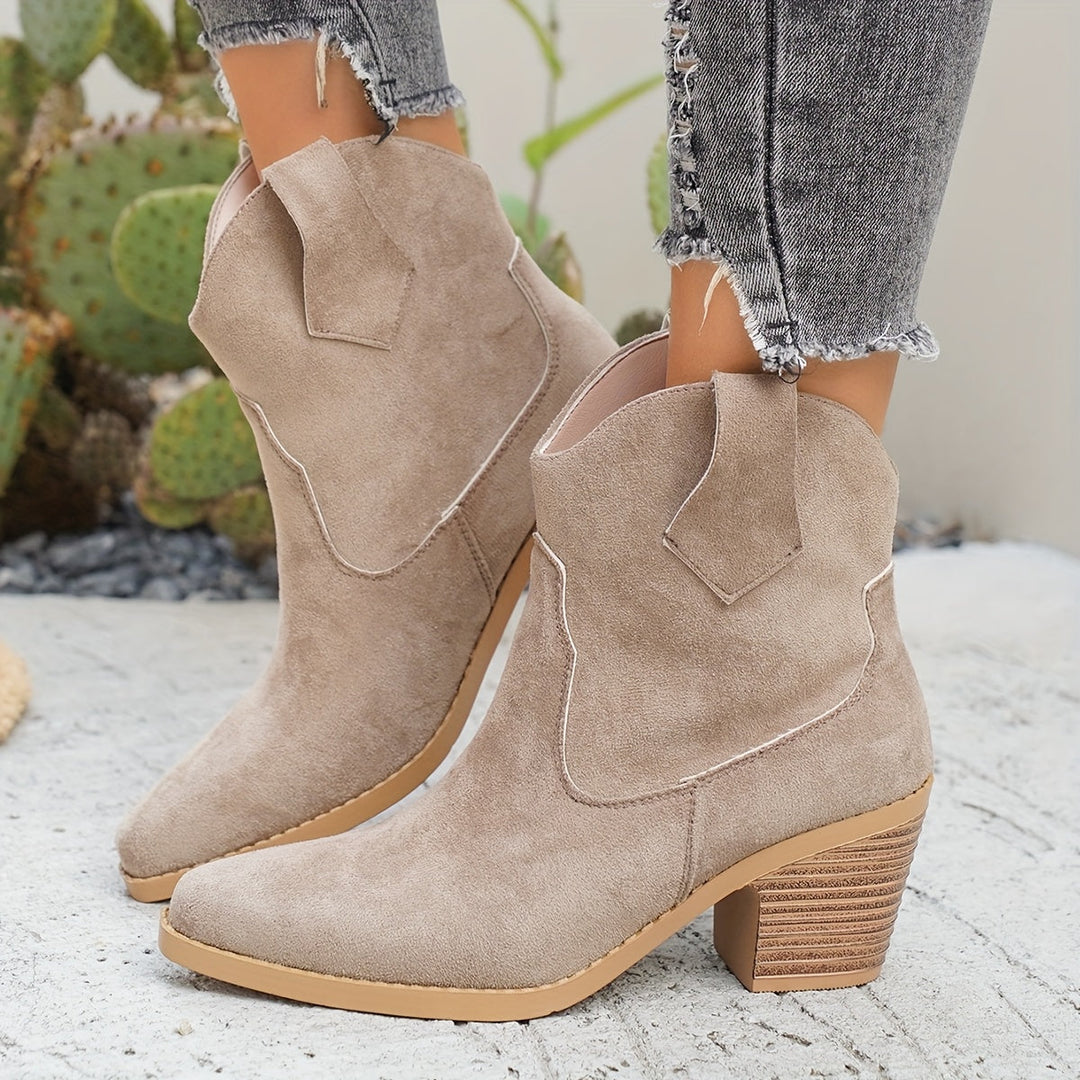 Stylish women's Western Chelsea pull-on ankle boots with a pointed toe & block heel, perfect for fall fashion.