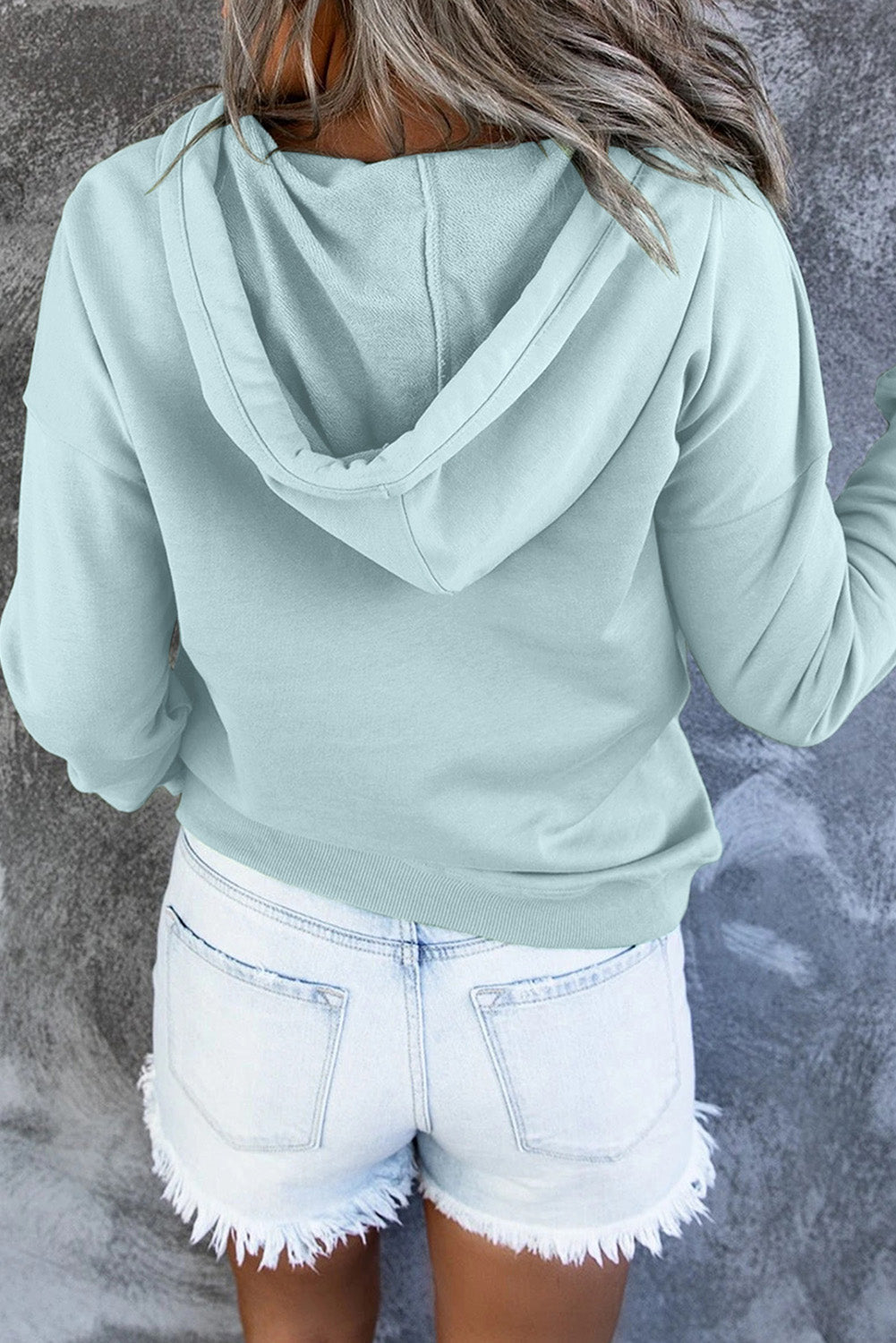 Back view of a women's relaxed fit hooded sweater. Cozy, comfortable & stylish apparel.