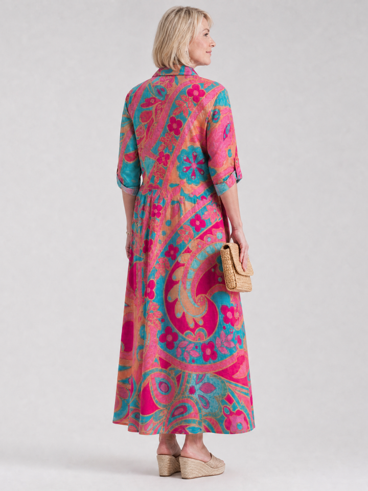 Comfortable women's collared midi dress with a vibrant print, button-front, and short sleeves. Great for everyday wear.