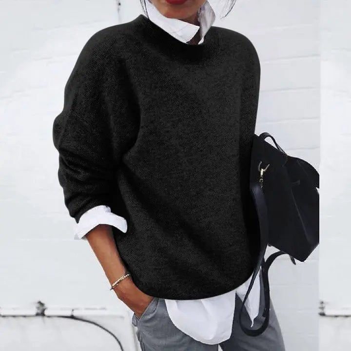 Chic women's relaxed fit crew neck pullover sweater made from soft knit, perfect for versatile daily wear.