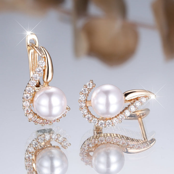 Champagne gold pearl drop earrings with sparkling diamond style accents. Women's elegant jewelry gift.