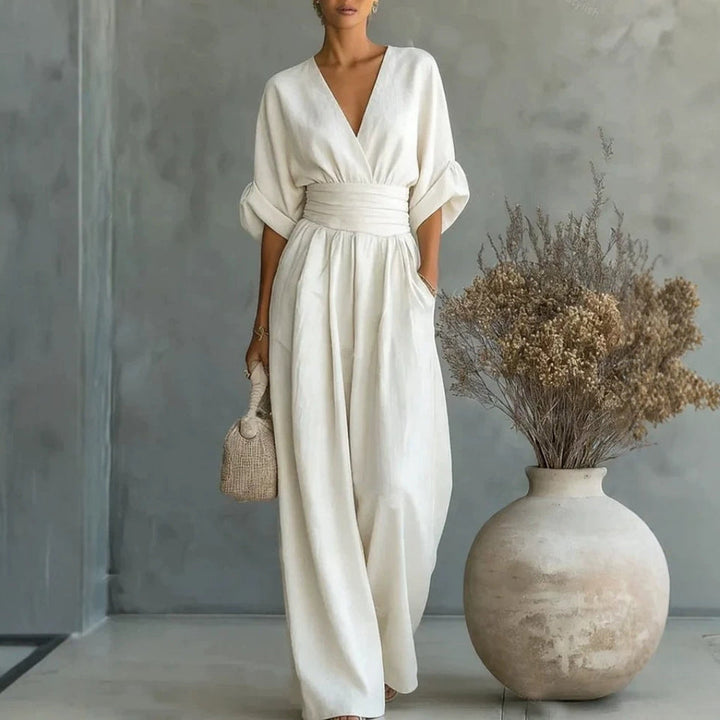 Relaxed fit women's V-neck jumpsuit with short sleeves and wide legs, ideal for summer travel & casual wear.