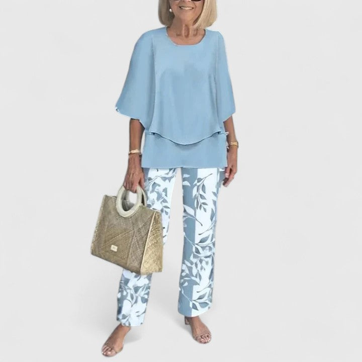 Women's elegant two-piece ensemble. Relaxed fit top & trousers for casual chic day-to-night versatility.