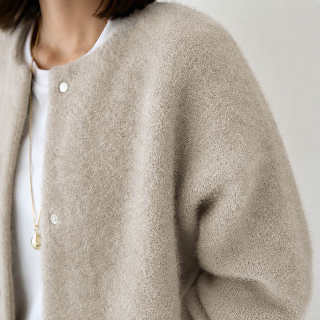 Elegant mid-length women's cardigan with buttons, perfect for layering & everyday wear.