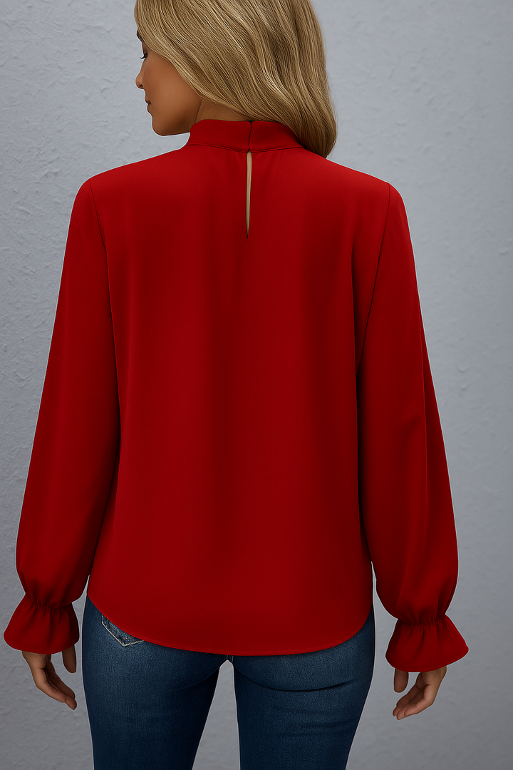 Chic women's long sleeve blouse with elegant tie neck and stylish ruffle cuffs.