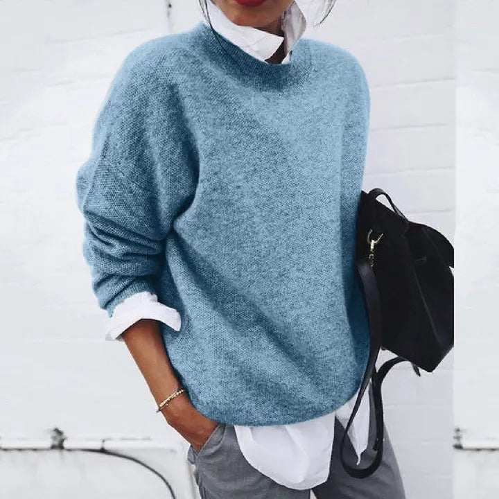 Soft knit women's relaxed crew neck pullover sweater, ideal for versatile seasonal and casual wear.