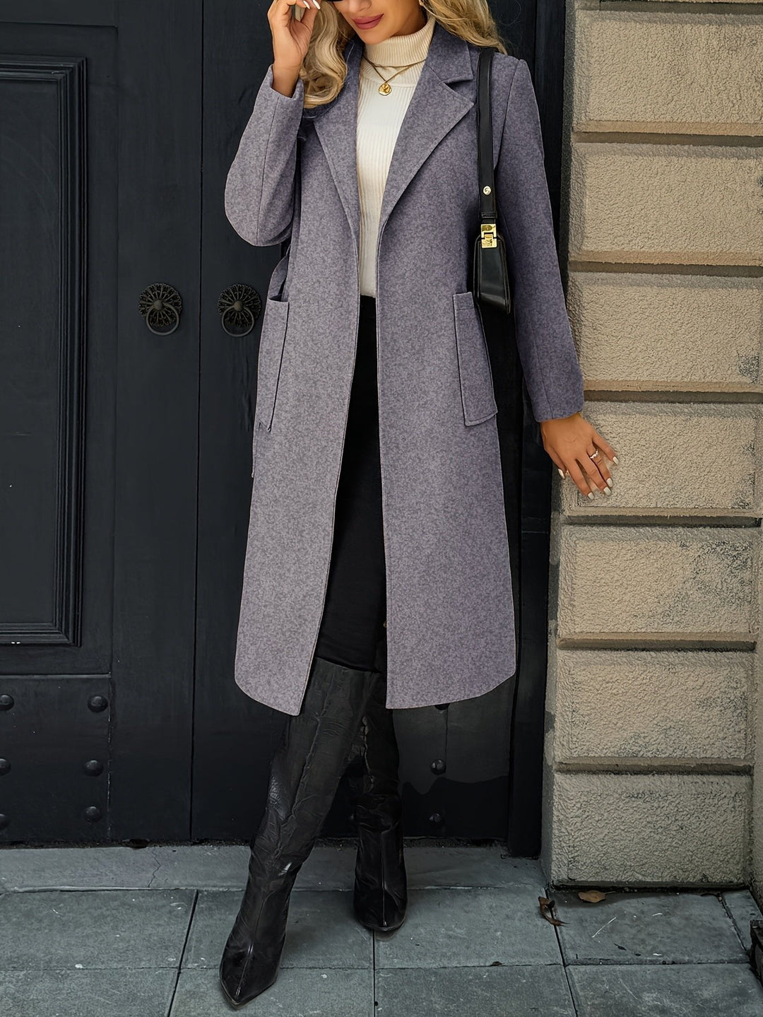 Woman with hands in pockets of a long belted trench coat. Elegant tailored style, sophisticated outerwear.