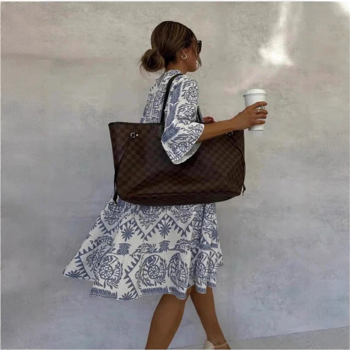 Soft, comfortable women's floral print midi tunic dress. Relaxed silhouette, perfect for warm weather casual outfits.