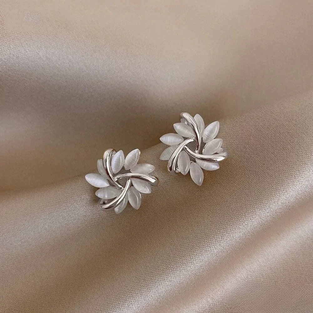 Delicate silver opal flower earrings for women, showcasing an elegant and sparkling floral design.