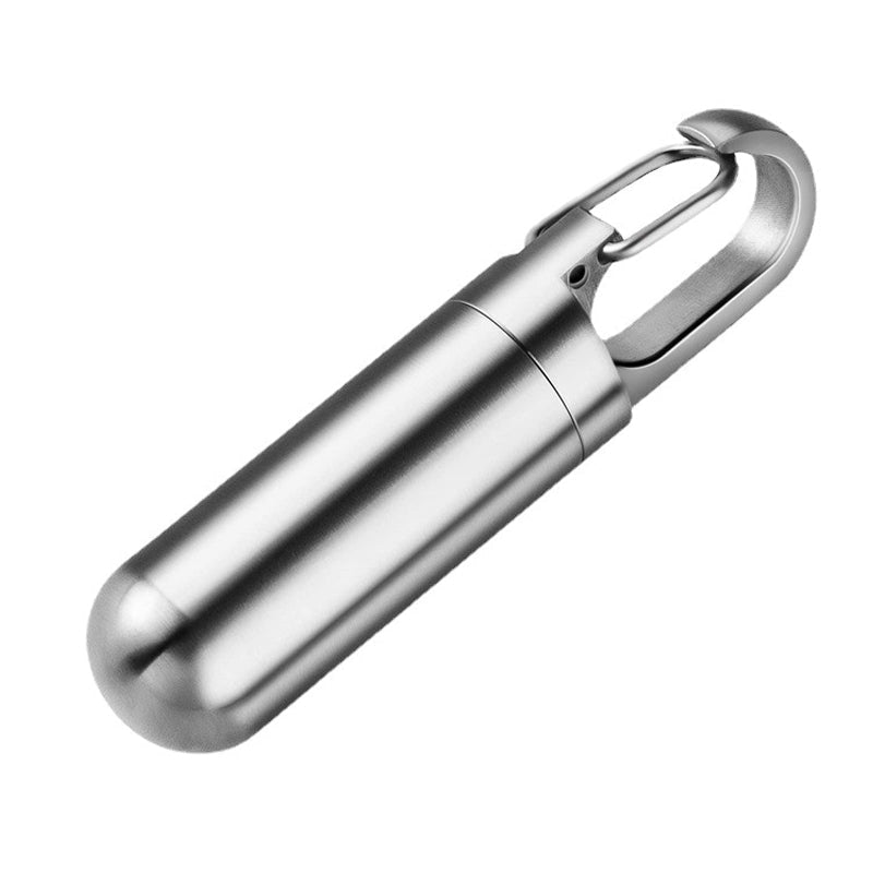 Portable waterproof pill box with keychain, ideal for daily essentials & travel medication.
