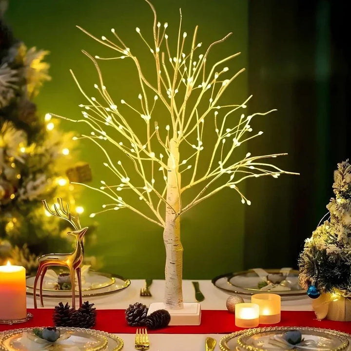 Close-up of decorative Nordic birch tree lamp showcasing flexible branches & glowing warm white LED lights.
