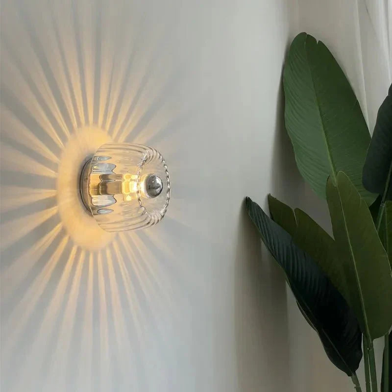 Sleek metal & glass Bauhaus wall sconce, modern lighting fixture ideal for contemporary home interior.