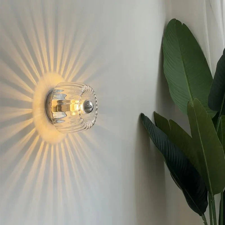 Sleek metal & glass Bauhaus wall sconce, modern lighting fixture ideal for contemporary home interior.