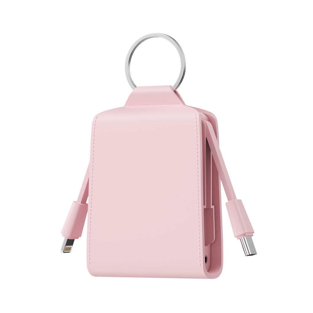 Compact CJ26 emergency power bank, a travel essential portable charger with dual cables for phones.