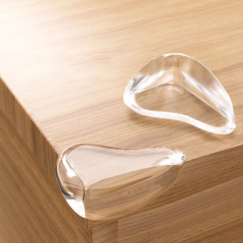 4-pack clear silicone corner guards for baby safety & child proofing sharp furniture edges. Essential home protection.